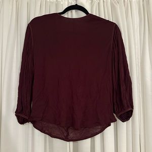 Babaton blouse in burgundy with open back